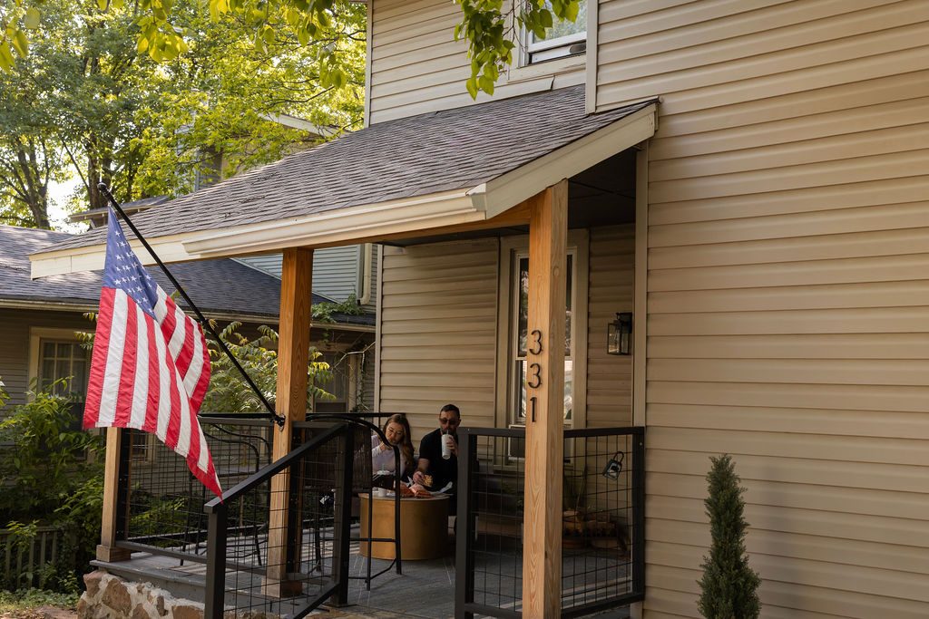 The front porch, flag flying